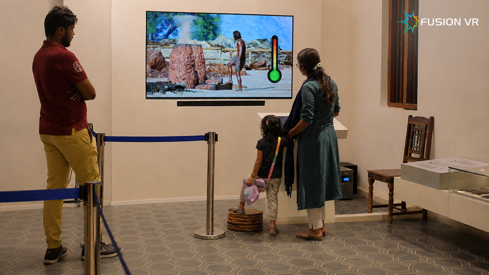 Interactive iron smelting exhibit with foot-operated bellows at Porunai Museum