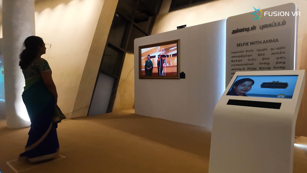 Selfie with Amma gesture-controlled augmented reality photo station