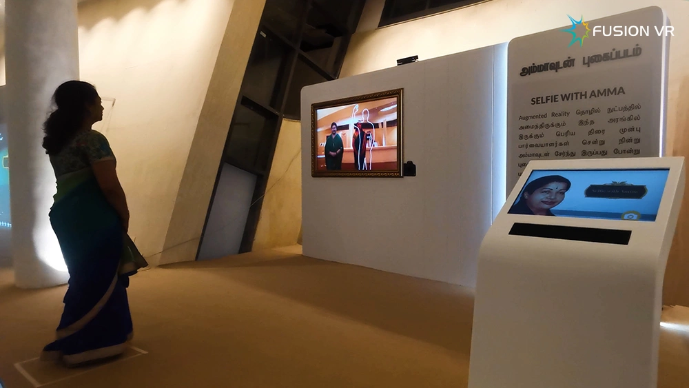 Selfie with Amma gesture-controlled augmented reality photo station